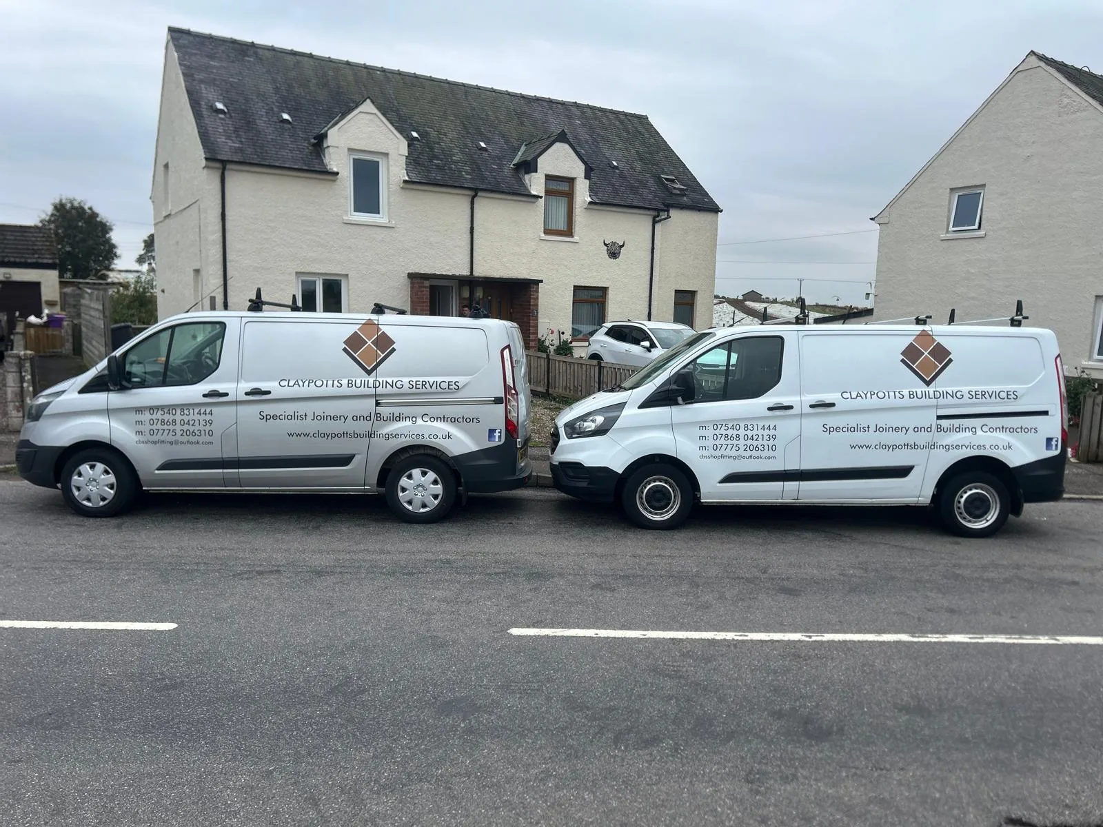 Two Claypotts Building Services vans parked together